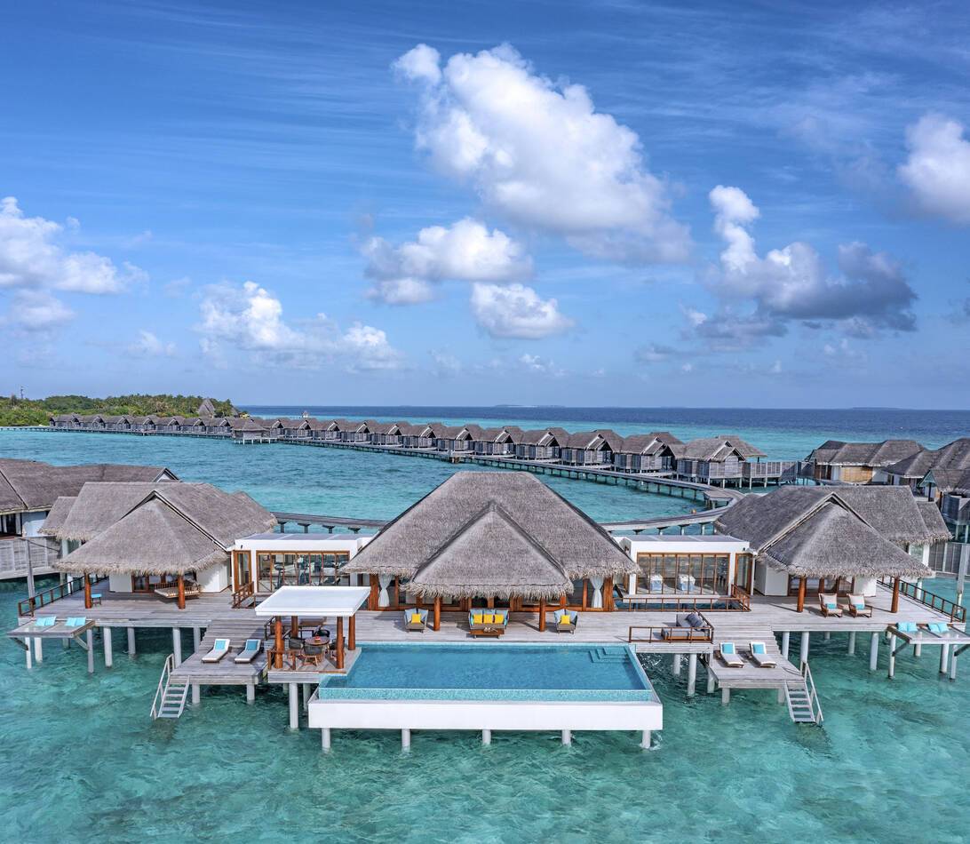 Anantara Kihavah Resort Maldives Over water pool residence aerial daylight