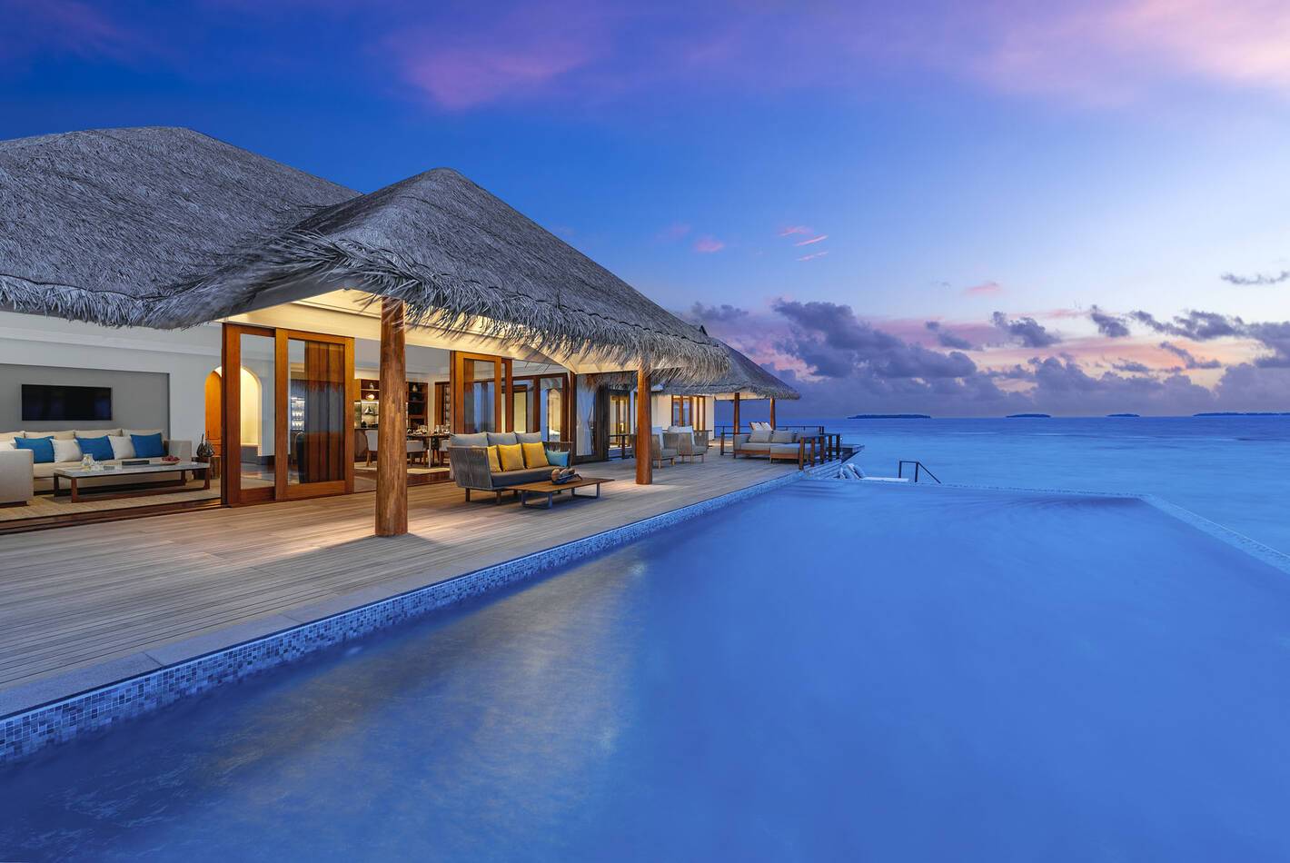 Anantara Kihavah Resort Maldives Over water pool residence deck sunset