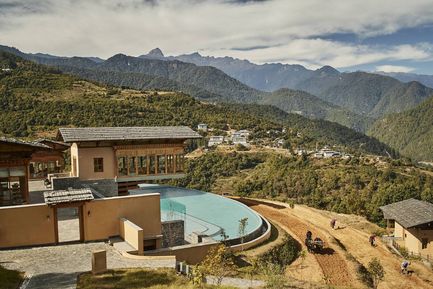 Six Senses Punakha Bhoutan Flying Farmhouse and paddy fields with farmers